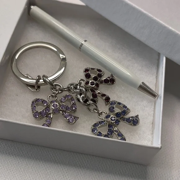 Elegant Coach Bow Keychain with Multicolor Crystals and a White Coach Pen - Picture 6 of 6